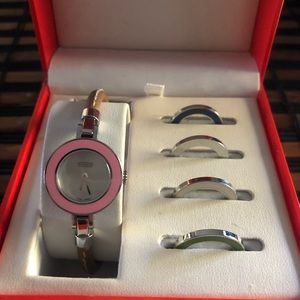 Coach watch with changeable bezels